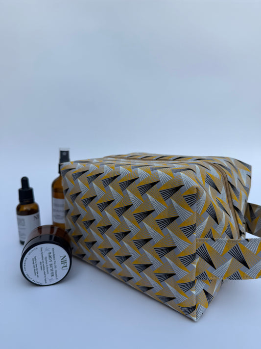 Patterned fabric with skincare products on a white background